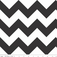 a black and white chevroned pattern with a ruler in front of the image