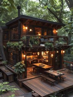 a small wooden cabin in the woods with lights on