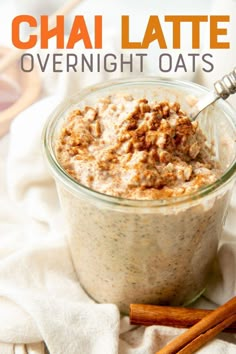 an overnight oatmeal in a glass jar with cinnamon sticks on the side