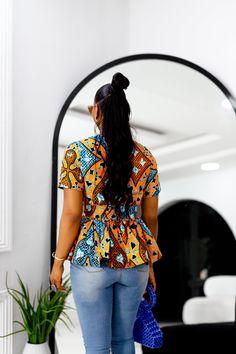 Elevate your wardrobe with the DUNNI African Print Front Zip Peplum Top. Its vibrant print, lined fabric, and chic peplum design will have you turning heads. Show off your boss style and step up your fashion game with this must-have top. Zip up and get ready for all the compliments. FEATURES.* 100% African Wax Cotton* Front Zipper with Peplum style * Top is Lined with Detachable belt included* Model Is Wearing A Size SmallCARE INSTRUCTION* Hand Wash in Cold Water.* Do Not Bleach.* Press with Cool Iron on The Wrong Side Peplum Design, Boss Style, Peplum Designs, Peplum Styles, Waxed Cotton, African Print, Skirt Pants, Jacket Tops, Step Up