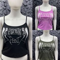 This is a Rudimentary Peni crop tank top with spaghetti straps. Available in three colors black, pink, and army green. sizes from a Small to XXL. This has a Rudimentary Peni image screen printed on the front. 57% cotton/ 38% polyester/ 5% Spandex These are handmade screen-printed and slightly vary from the photo. Please feel free to email me any questions. Thanks for looking. Due to an influx of incorrect addresses if a package is returned, you must pay the shipping cost to resend the item to yo Sleeveless Stretch Punk Crop Top, Y2k Tank Crop Top For Night Out, Spring Tank Top For Concert, Punk Stretch Crop Top, Punk Style Stretch Cropped Tops, Stretch Cropped Punk Tops, Punk Style Cropped Stretch Tops, Trendy Graphic Print Camisole Tank Top, Trendy Camisole Tank Top With Graphic Print