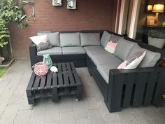 a couch and coffee table on a patio