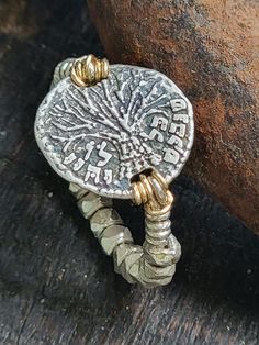 This one of a kind handmade Tree of life coin ring that symbolizes uniqueness and personal growth is made of sterling silver. The coin is a lereve creation that says in Hebrew " כל שנבקש לו יהי"  "may all your wishes  come true".   A great piece to treat yourself   A Meaningful great gift for a stylish women or teens for any occasion. It is available in different sizes. We also accept special orders but prices may vary. Due to the handmade work and wire wrap, some details might change from one p Ring Symbolism, Tree Of Life Ring, Handmade Tree, Viking Helmet, Bat Mitzvah Gifts, Tree Rings, Coin Ring, Healing Jewelry, Cool Necklaces