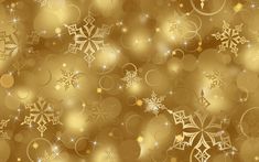 a gold background with snowflakes and stars