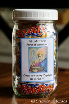 a jar filled with candy sitting on top of a wooden table