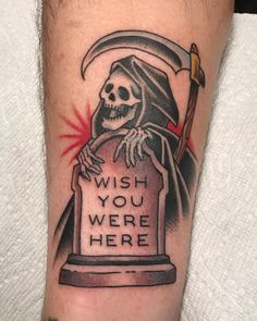 a man's arm with a tattoo on it that says wish you were here