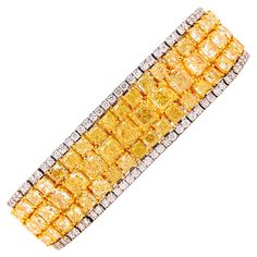 Showcasing a knockout natural yellow diamond bracelet with approximately 46.81ct total weight. Measures 1.80cm wide or 3/4 of an inch and 7 inches long. The color hue and saturation in our opinion face up as fancy intense after setting! Every diamond is full of fire. Hand made in the Emilio Jewelry Atelier, whom specializes in rare collectible pieces in the fancy color diamond field. The clarity of the diamonds are vs1 -vs2 overall. VIDEO AVAILABLE. Please inquire for more images, the certificat Yellow Diamond Bracelet, Emilio Jewelry, Jewelry Atelier, Yellow Diamond Jewelry, Fire Hand, Graff Diamonds, Flexible Bracelet, Retro Bracelet, Yellow Diamonds