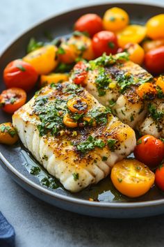 Grilled fish topped with herbs and surrounded by cherry tomatoes on a plate. Halibut Meals, Halibut Dishes, Smoked Halibut, Halibut Recipes Baked, Seafood Cuisine, Baked Halibut, Roasted Halibut, Halibut Recipe, Mediterranean Foods