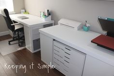 a white desk with drawers and a laptop on it