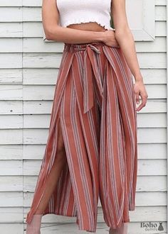 Women's loose striped bohemian pants with side slit These big boho pants for ladies with stripes have a slit on the side and are ideal for creating a free and daring style. You can wear them with a flowy blouse or a tiny lace top. You can even wear a crop top because of the high waist! These pants are perfect for a warm evening when paired with heeled sandals. They're excellent for a trip to the city when paired with a pair of white sneakers. In the table below, you will find the measurements of Bohemian Pants, Cozy Pants, Bohemian Style Clothing, Boho Style Outfits, Square Pants, Striped Wide Leg Pants, Casual Bottoms, Stylish Pants, Boho Pants