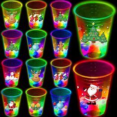 many different colored plastic cups with santa clause on them