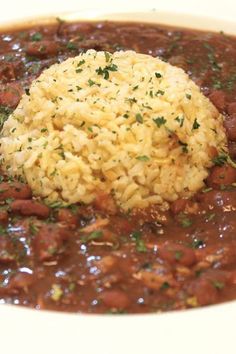 a white bowl filled with beans and rice