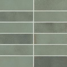 a tile wall with several different shades of gray