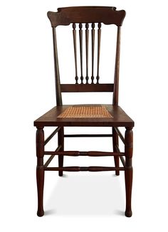 a wooden chair with a wicker seat and backrests on an isolated white background