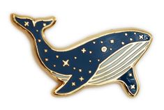 a blue whale pin with stars on it