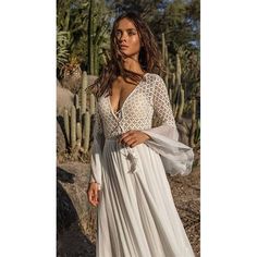 Long Flare Sleeve V Neck White Tassel Hollow Boho Lace Maxi Dress | Uniqistic.com Boho Lace Maxi Dress, Evening Dresses With Sleeves, White Tassel, Chiffon Fashion, Boho Style Dresses, Boho Lace, Backless Maxi Dresses, Lace Dress Long, Pleated Maxi Dress