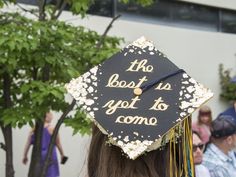 a graduation cap that says the best is yet to come