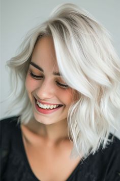 This white-blonde hair color exudes a strikingly pure and platinum-like radiance. It's a cool-toned shade that carries the luminous intensity of freshly fallen snow, enhancing the hair with a sleek, almost ethereal quality. Click here to see more blond hair color ideas. Creamy Neutral Blonde Hair, White Blonde Hair Color, Neutral Blonde Hair