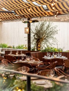 an outdoor dining area with tables and chairs