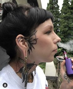 Sideburn Tattoos For Women, Face Tattoo Near Ear, Mandala Face Tattoo Design, Small Side Face Tattoo, Elegant Face Tattoo, Small Side Of Face Tattoo, Side Of Head Tattoo Women, Face Tatoos Woman, Blackwork Face Tattoo