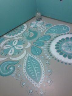 the floor is painted with blue and white paint, it looks like an intricate design