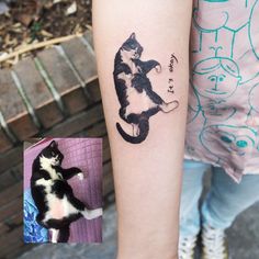 a black and white cat tattoo on the left arm, next to a photo of it's owner