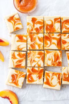 slices of orange and white cake next to some sliced peaches