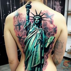 a woman with a statue of liberty tattoo on her back