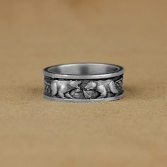 a wedding band with elephants on it