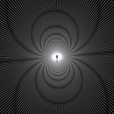 a person standing in the middle of a black and white tunnel with light at the end