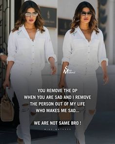 two women in white outfits walking down the street, one with her hand on her hip