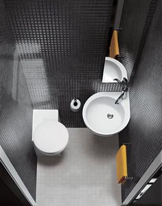 a bathroom with two sinks and a toilet