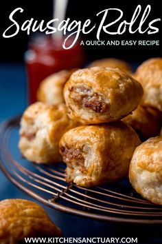 sausage rolls on a wire rack with ketchup