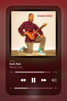 an image of a man that is playing music on his cell phone and has the caption dark red steve lacy