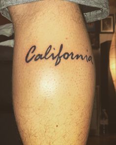 the word california written in cursive ink on someone's leg