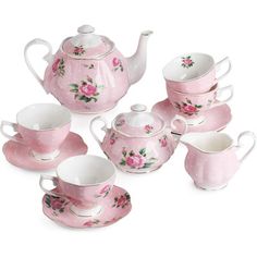 a pink tea set with matching cups and saucers