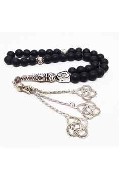 Totally 33 beads have matte black onyx prayer beads. We use 8 mm beads. Cord is black and its very strong. Metal parts are stainless. Tassels with kazaz, and some parts have moon and star sign. Gift for men Gift for boyfriend Gift for dad Gift for grandfather Who you will give this gift they will be very like this %100. Islamic Tasbih, Arabian Prayer Beads, Tasbih, Sufi, Misbaha Traditional Black Rosary As Gift, Spiritual Black Beads With Silver Accents, Silver Rosary With Black Beads As Gift, Black Rosary With 108 Beads As Gift, Spiritual Black Rosary With 108 Beads, Traditional Black Rosary With 8mm Beads, Adjustable Black Rosary With 8mm Beads, Prayer Beads Islam, Tasbih After Fajr