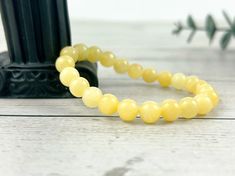 Yellow Calcite gemstones Bracelet made in stretch cord ❤ Measurements- Beads are available in the sizes of 8mm and 10mm. You can pick the Bead Size and bracelet length of your choice from the drop down menu. Please reach out to me if your desired size is not listed. I will gladly work with you to create the one per your choice. ❤ Processing Time - Ships Next Day Handmade in USA! How to measure the bracelet size? Please measure your wrist where you want the bracelet to fit the best. Measure using Yellow Beaded Bracelet, Yellow Bracelet, Yellow Calcite, Men Bracelet, White Pearl Necklace, Natural Stone Bracelets, Bracelet Gemstone, Bracelet Ideas, Bracelet For Men