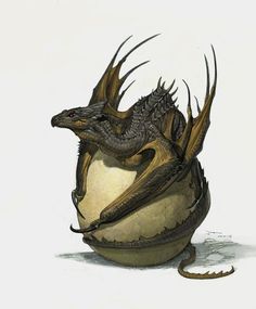 an egg with two dragon heads sitting on it's side and one is facing the viewer