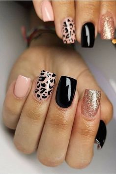 black and gold nail polish with leopard print on the tip, pink and white nails