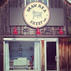 the outside of a building with an awning and sign that says, barn ma sheep