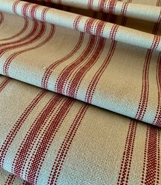 two red and white striped fabric on top of each other in different sizes, shapes and colors