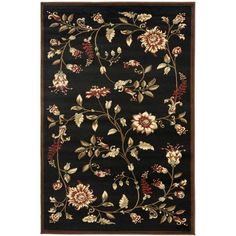 a black rug with flowers and leaves on it