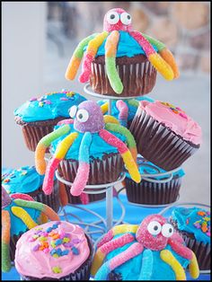 cupcakes decorated with colorful icing and decorations