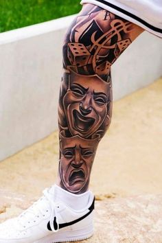 a man's legs with tattoos and shoes on them, all covered in masks