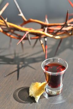 a shot of tea with a crown of thorns in the background royalty images and stock photos