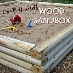 a wooden sandbox with toys in it and the words do it yourself wood sandbox