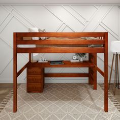 a wooden bunk bed sitting on top of a rug next to a desk and chair