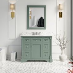 a bathroom with a green vanity and mirror