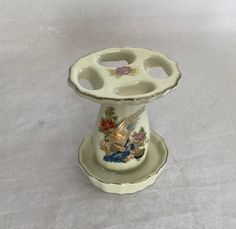 "JAPANESE ART Porcelain toothbrush holder with a golden pheasant and flower motif.  The vintage gold-trimmed bathroom toothbrush stand holds four toothbrushes.  Beautiful Japanese cloisonne artwork; nesting pheasant and flowers. This porcelain toothbrush stand is in excellent pre-owned vintage condition.  No chips, or cracks, some light underglaze crazing.  The pretty porcelain toothbrush holder stands approximately 4\" tall x 3\" wide." Vintage Toothbrush Holder, Cloisonne Art, Tooth Brush Holder, Golden Pheasant, Tooth Brush, Pottery Crafts, Art Japonais, Flower Motif, Soap Holder